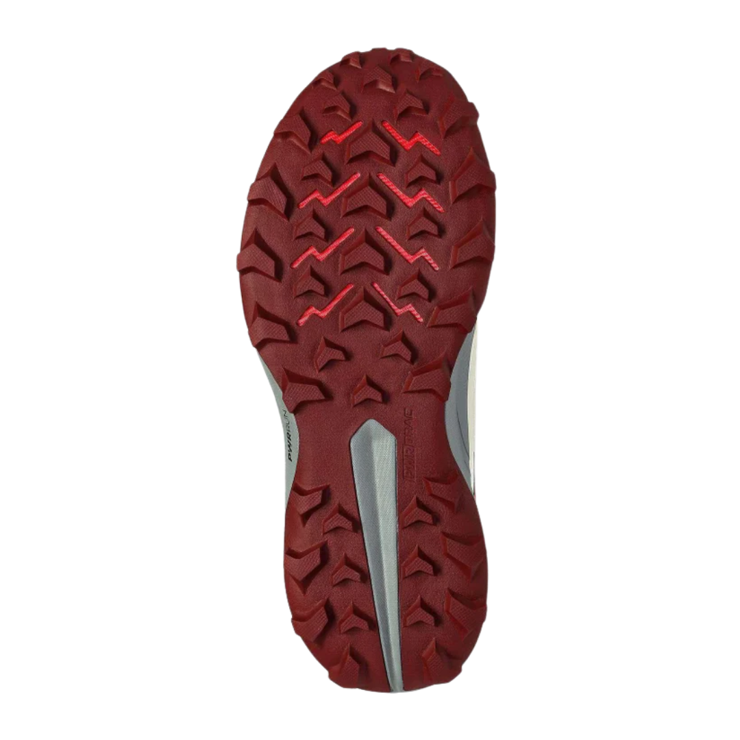 Bottom view of Women’s Saucony Peregrine 13 in Glow/Sundown – featuring a grippy PWRTRAC rubber outsole with deep, directional lugs, high-traction zones at the heel and toe, and lightweight design for confident footing on varied surfaces.