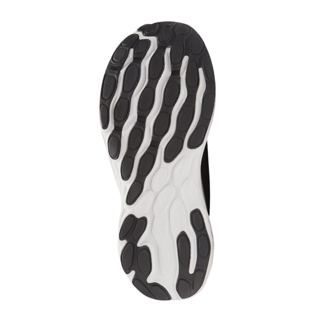 Bottom View of Women’s New Balance Fresh Foam X 1080v13 running shoe in black with white – featuring durable rubber outsole with multi-directional traction, flex grooves for natural foot movement, and reinforced heel for stability.